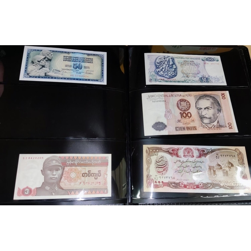 250 - A collection of 56 world banknotes in album
