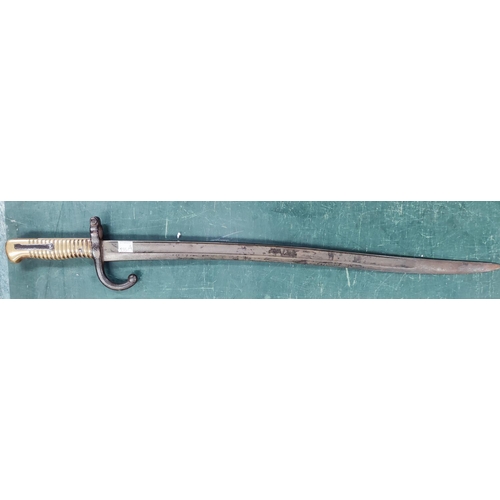 295A - A 19th century French bayonet with brass handle, engraved with date 1867, 70cm