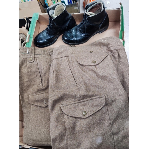 296 - Two part military combat trousers and a pair of boots