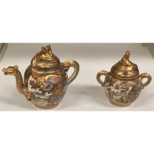 421 - A Japanese Satsuma earthenware dragon teapot , 17cm and a matching sugar basin (lid damaged)