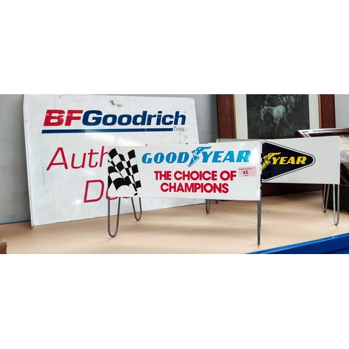 45 - Two Goodyear Tires vintage advertising stands and a BF Goodrich Tires advertising sign