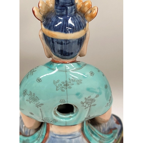 450E - A Chinese ceramic figure of a Buddha in seated lotus position with hole to back possibly for wall ha... 