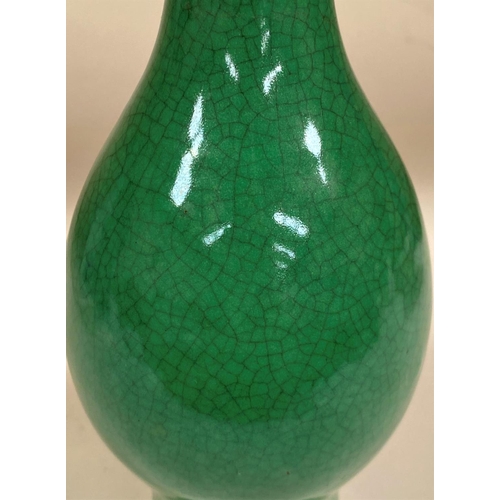 457 - A Chinese late 19th/early 20th century monochrome vase with crackle green glaze, bulbous tapering at... 