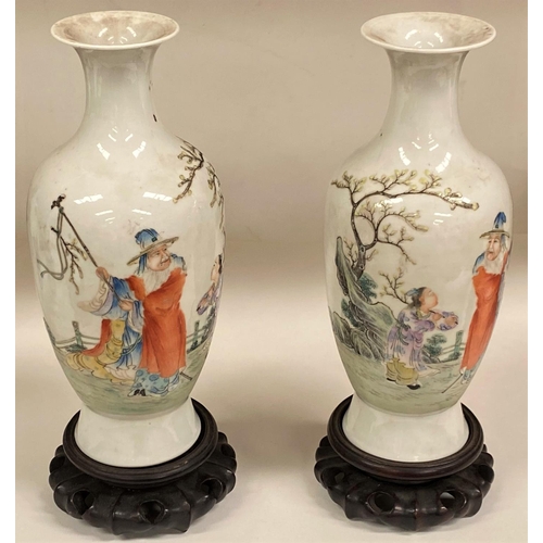 459 - A Chinese pair of late 19th/early 20th century vases decorated with old man and younger boy, four ch... 