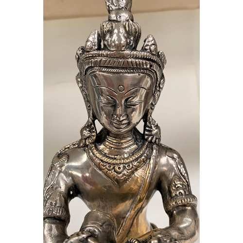 464 - An anodised brass figure of Buddha, 27cm