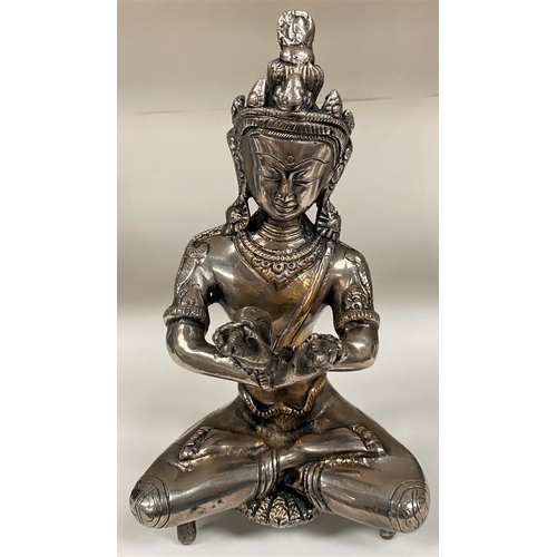 464 - An anodised brass figure of Buddha, 27cm