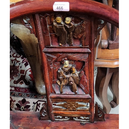 466 - A Chinese stained wood chair with carved splat and horseshoe back