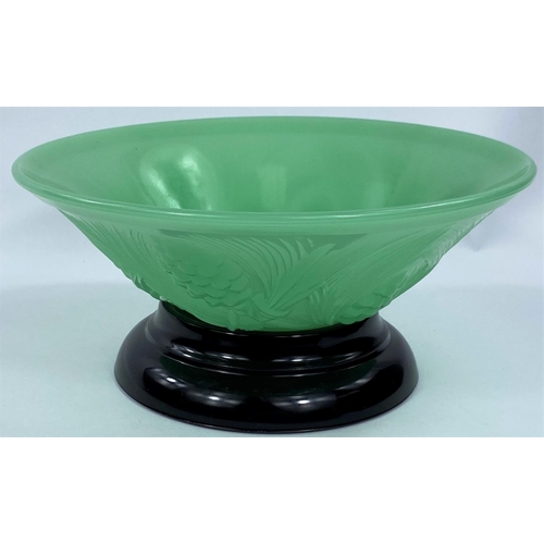 535 - An Art Deco green moulded glass bowl with stand, Reg. No. 777133, 27cm diameter 