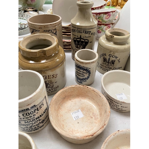 539 - A selection of stoneware advertising jars, various sizes.  Some pots reproduction or with later tran... 