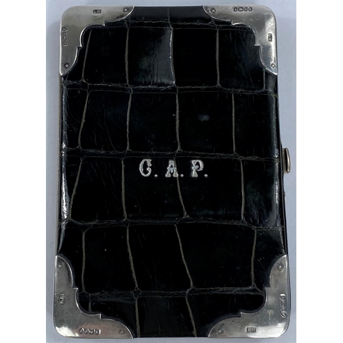 685A - A hallmarked silver mounted reptile wallet, dark green, monogrammed C.A.P. Birmingham 1904, maker Lu... 