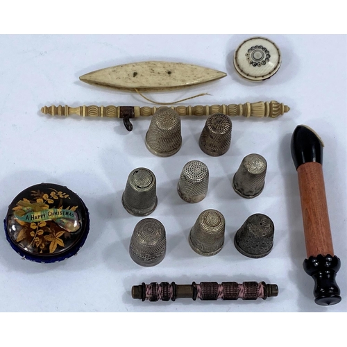 689 - A selection of Victorian and later sewing items, needle cases, hair etc.; silver white metal thimble... 