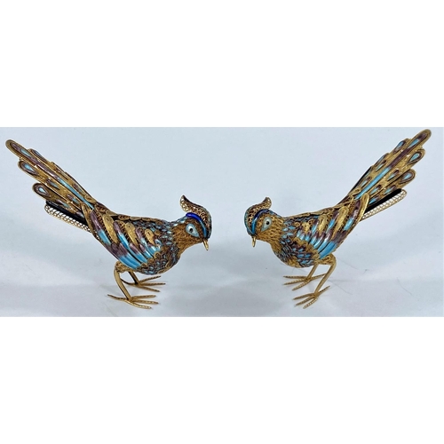 691A - A pair of gilt Chinese parcel filigree and cloisonne enamel birds (1 leg at fault) marked silver to ... 