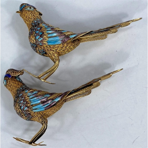 691A - A pair of gilt Chinese parcel filigree and cloisonne enamel birds (1 leg at fault) marked silver to ... 