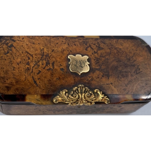 691B - A 19th century walnut and tortoiseshell snuff box, yellow metal mounts (slightly damaged)