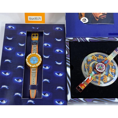 709B - 2 boxed Swatch Watches Try to Make a Better World & Wake Up! Wake Up!