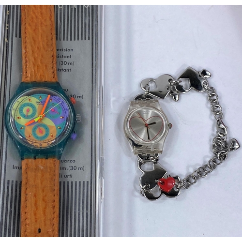 711B - A boxed charm bracelet Swatch Watch; a cased Swatch Chrono Watch