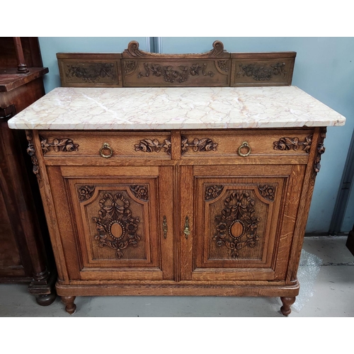 783 - A 19th century French oak side cabinet fitted cupboard and two short drawers, carved decoration, mar... 