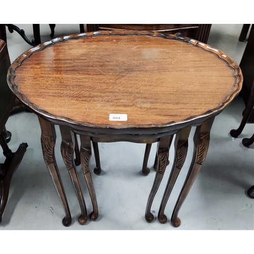 804 - A reproduction Regency mahogany nest of 3 occasional table with oval tops