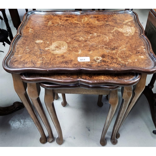 811 - A nest of 3 walnut occasional tables; a reproduction coffee table; a standard lamp