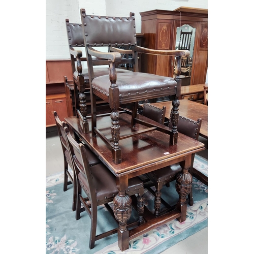 924 - An oak draw leaf refectory table with carved bulbous legs and 6 (4+2) studded leather effect chairs,... 