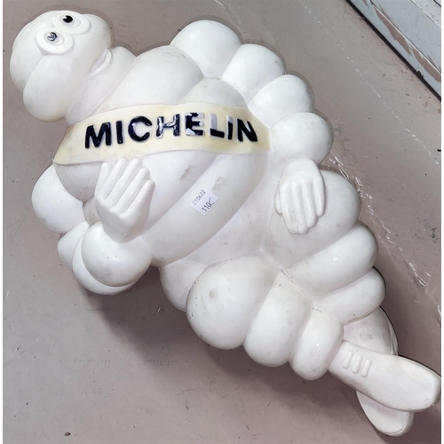110C - An unusual mid 20th century plastic Michelin Man model reclining, 45cm