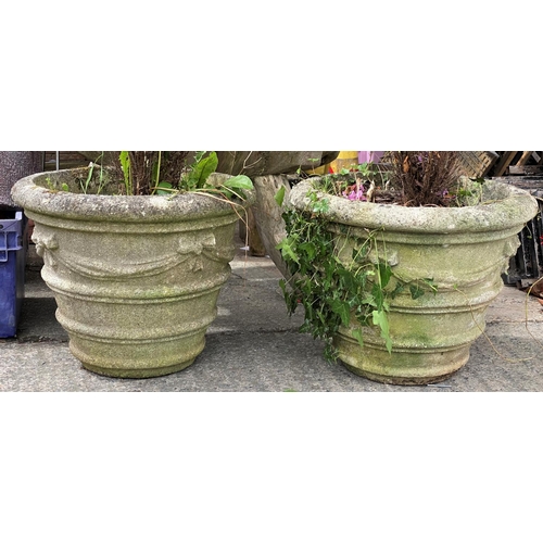 120A - A large pair of classical design reconstituted stone garden urns