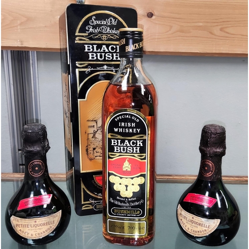 193b - A 700 ml bottle of Bushmills Black Bush Irish whiskey, in tin; 2 miniature bottles of Moët... 