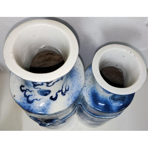 407 - An unusual Chinese blue and white conjoined larger and smaller vases decorated with bow in relief, d... 