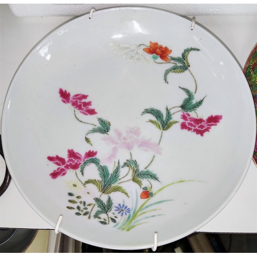 427A - A Chinese dish with polychrome flowers and mark to base and a Canton dish (a.f)