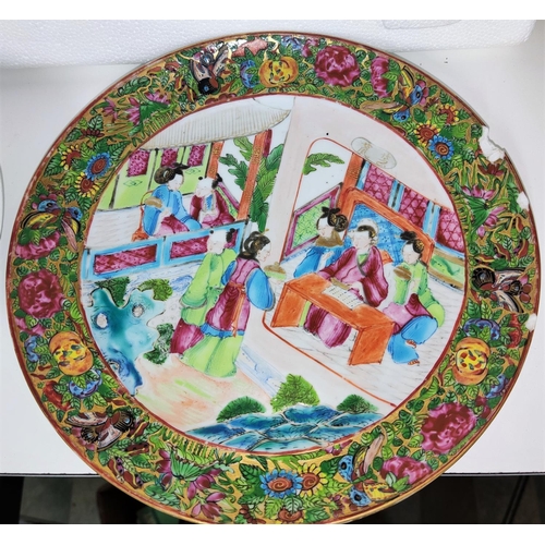 427A - A Chinese dish with polychrome flowers and mark to base and a Canton dish (a.f)