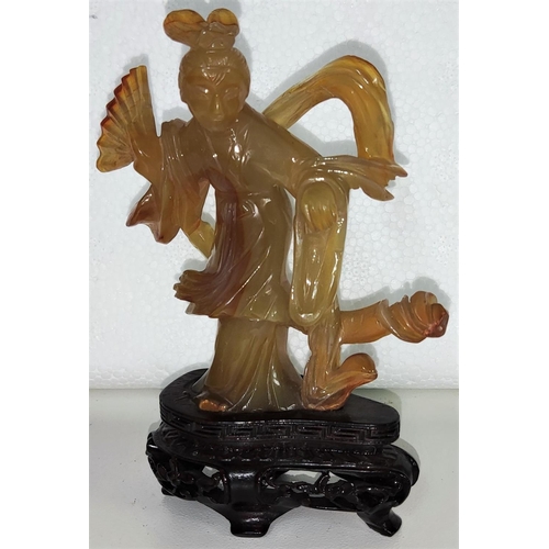 431 - A carved Chinese agate coloured female figure on wooden stand height 11.5cm