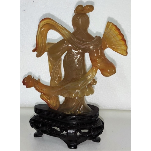 431 - A carved Chinese agate coloured female figure on wooden stand height 11.5cm