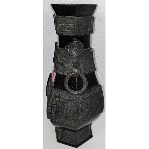 435 - A Chinese bronze hexagonal vase with ring handles incised decoration to body 24.5cm