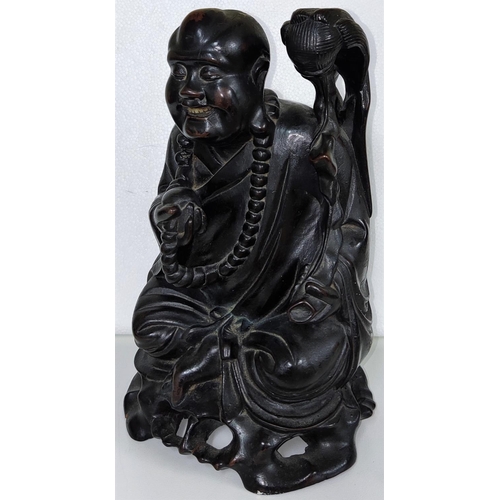 440 - A Chinese hardwood figure of a Buddha, height 24cm