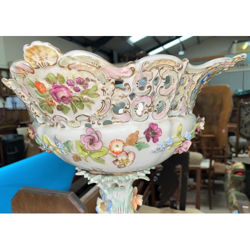 484 - A 19th century continental porcelain floral encrusted table centre with fruit bowl, applied figures,... 