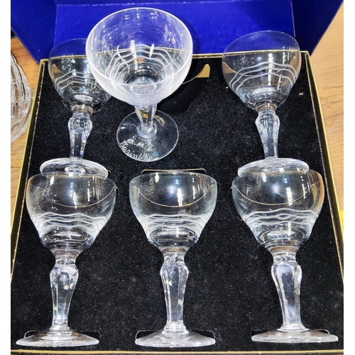 511 - A boxed set of Stuart crystal Cunard Steamship drinking glasses, etched for R.M.S Carinthia, a decan... 