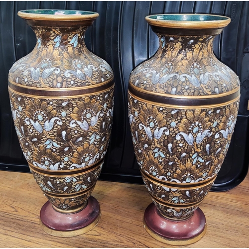 512 - A pair of Doulton Lambeth stone ware vases, swirling floral relief gilt and brown, marked AD X1901, ... 