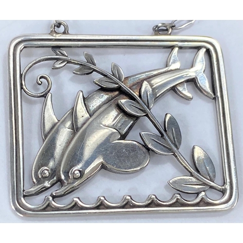 591 - Georg Jensen:  a silver pierced rectangular pendant/necklace with twin leaping dolphins and fro... 