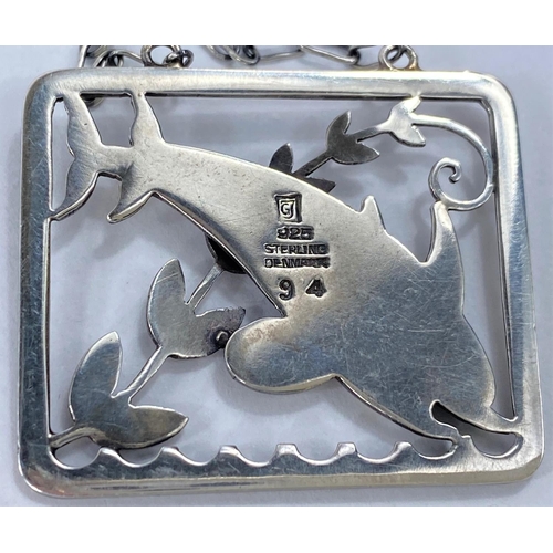 591 - Georg Jensen:  a silver pierced rectangular pendant/necklace with twin leaping dolphins and fro... 