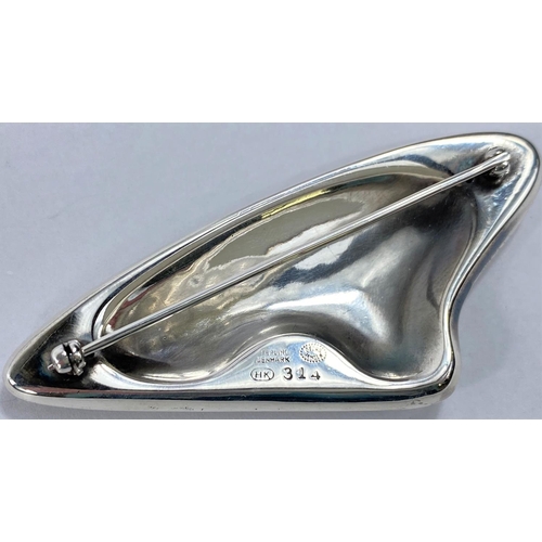 593 - Georg Jensen:  a silver brooch of abstract design by Henning Koppel, stamped Georg Jensen HK St... 