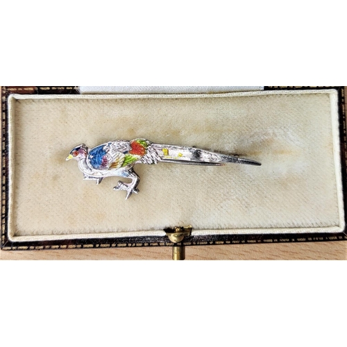 605 - A Chinese white metal and enamel bird brooch, character mark to the back (some enamel loss)