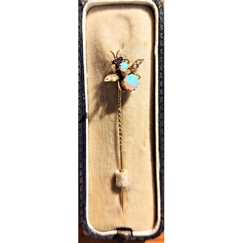 607 - A yellow metal insect pin set opals and seed pearls, ruby coloured eyes, stamped '9ct', boxed, 0.8 g... 