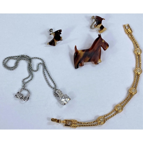 636 - Two pieces of Swarovski jewellery, a white metal drop necklace and a yellow metal bracelet and a vin... 