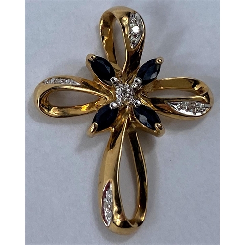 641 - A 14ct gold looping cross set with diamond chips and 4 small sapphires, 2.3gms