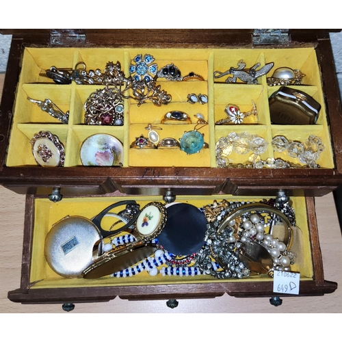 649D - A jewellery box containing various costume jewellery items, brooches, bangles etc