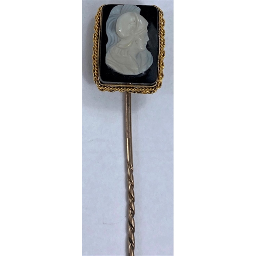 654 - A carved Sardonyx cameo stock pin