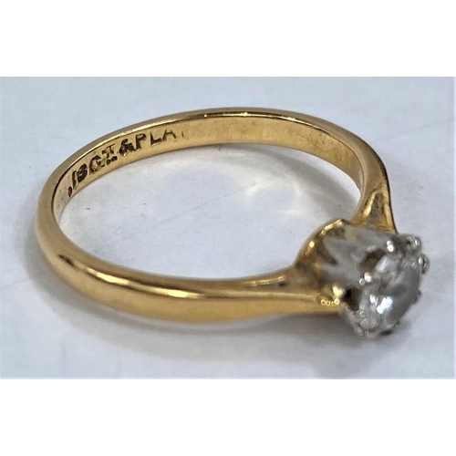 655 - A diamond solitaire ring in 18ct gold and platinum setting
