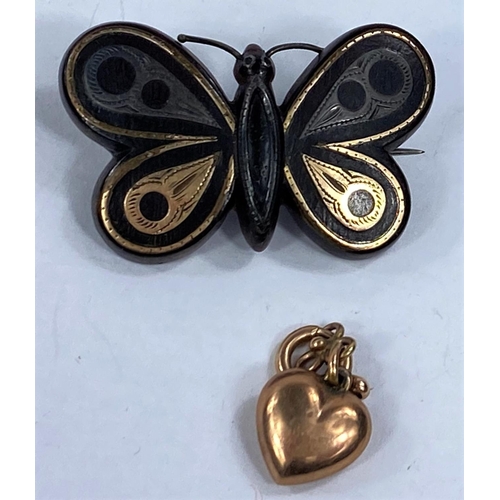 661 - A 19th century tortoiseshell butterfly brooch, a malachite set shield brooch etc