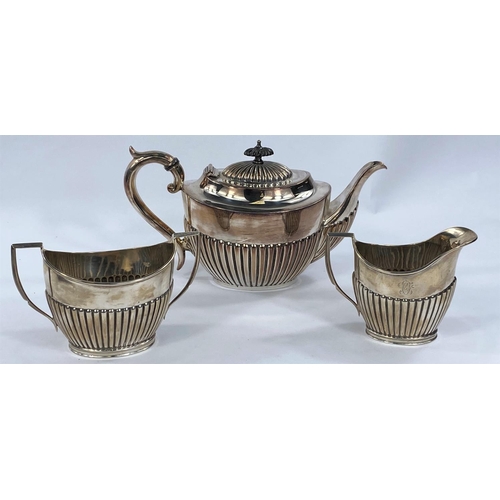 696 - A two piece set of silver milk jug and sugar bowl monogrammed with ribbed decoration, marks rubbed, ... 