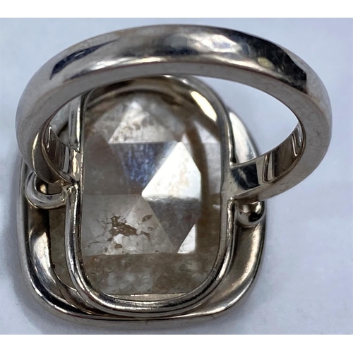 707 - By William Welstead, English jewellery designer, an 18 carat hallmarked white gold ring set with lar... 